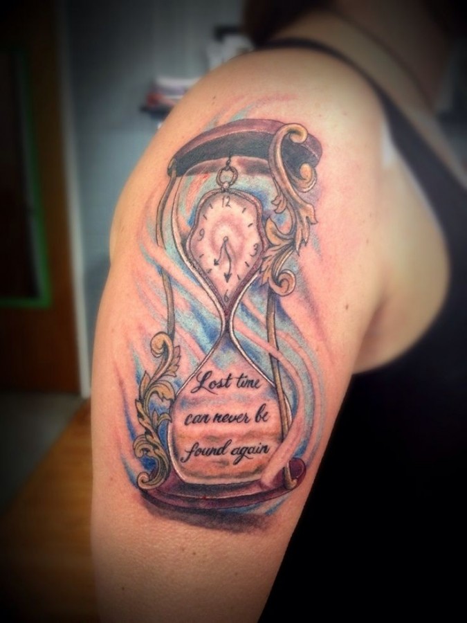 Gorgeous shoulder sand clock tattoo