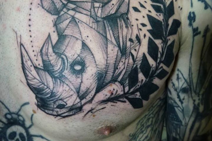 Great rhino chest tattoo by Tyago Compiani