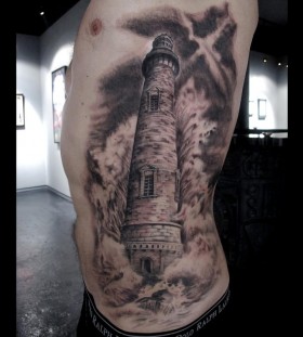 Huge lighthouse side tattoo