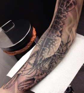 Huge lobster arm tattoo