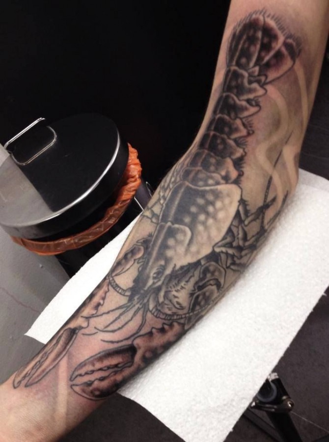 Huge lobster arm tattoo