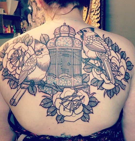 Incredible birdcage back tattoo