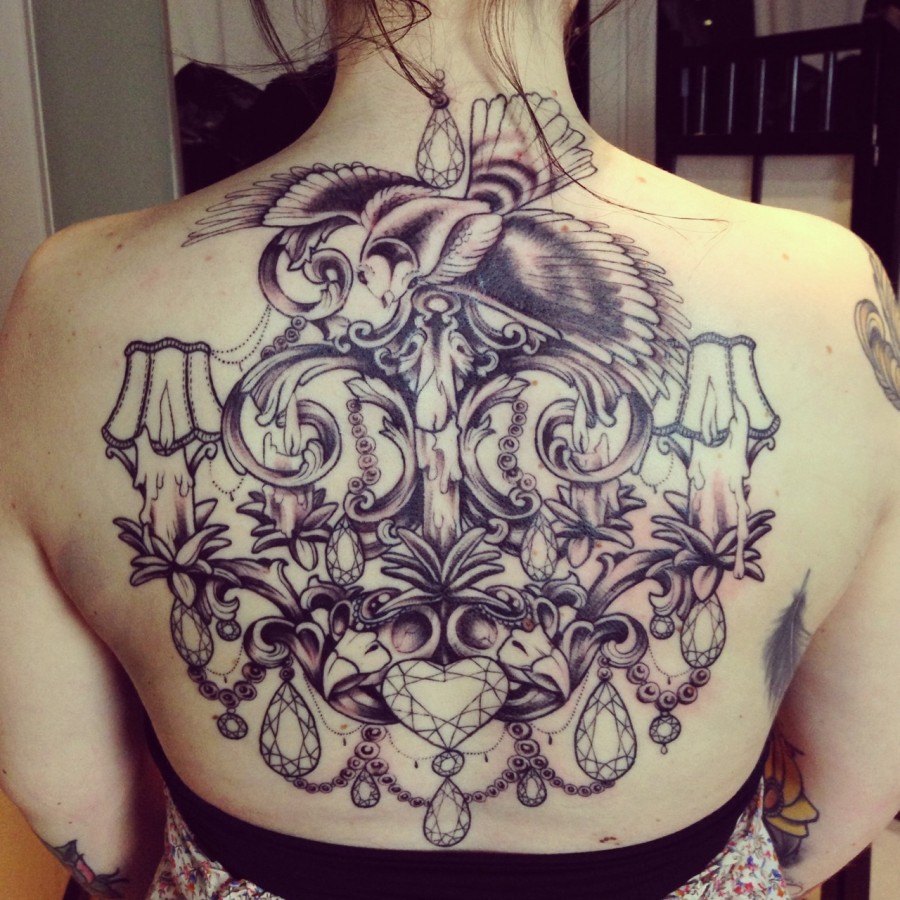 Incredible chandelier back tattoo