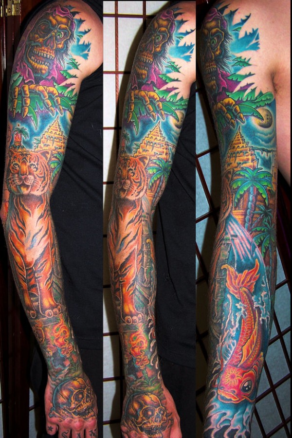 Jungle theme arm tattoo