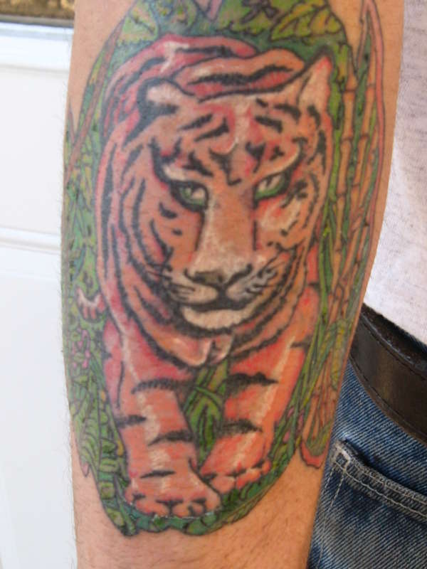 Jungle tiger arm tattoo