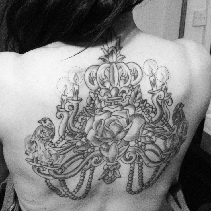 Large chandelier back tattoo