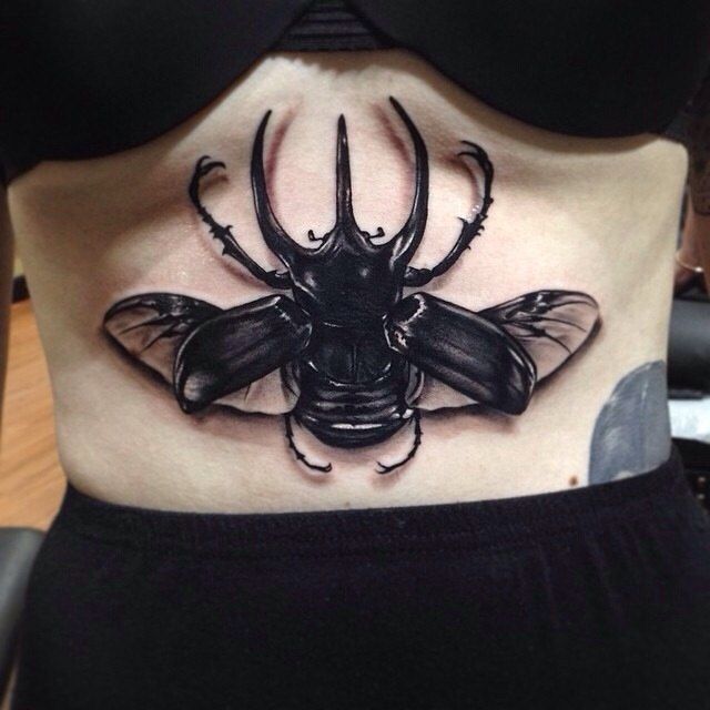 Large insect tattoo by Benjamin Laukis