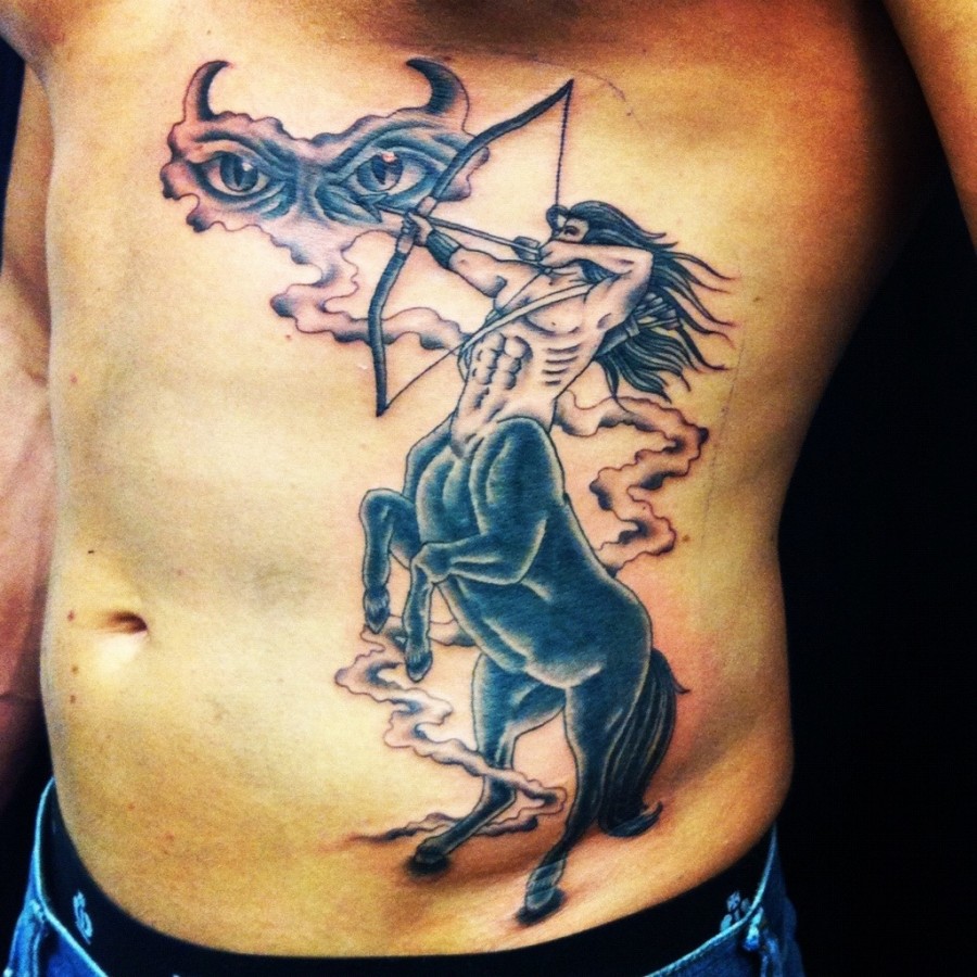 Large sagittarius side tattoo