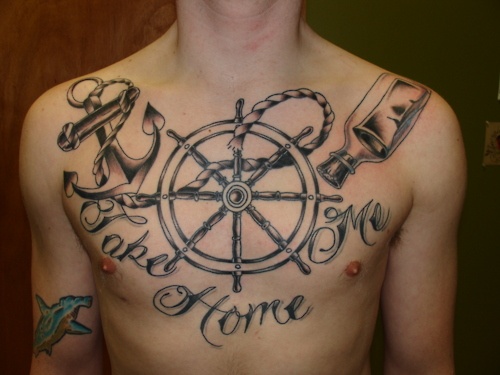 Large wheel chest tattoo