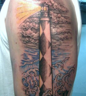 Lighthouse and clouds tattoo