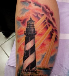Lighthouse and sunshine tattoo