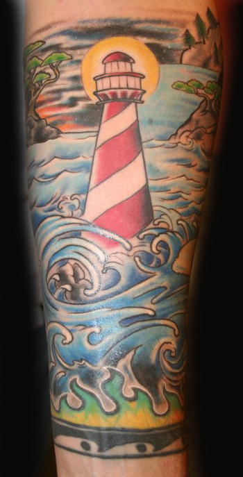 Lighthouse and waves tattoo