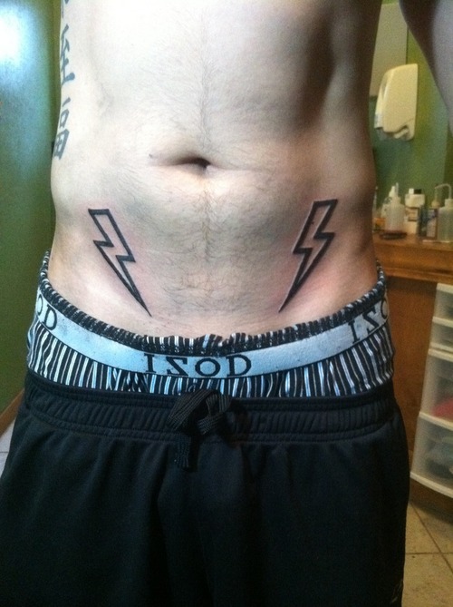 Lightning bolt stomach tattoo