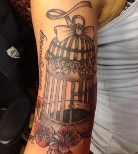 Lovely birdcage arm tattoo