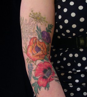 Lovely flowers tattoo by Esther Garcia