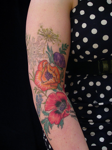 Lovely flowers tattoo by Esther Garcia