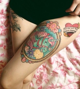 Lovely flowers unicorn tattoo