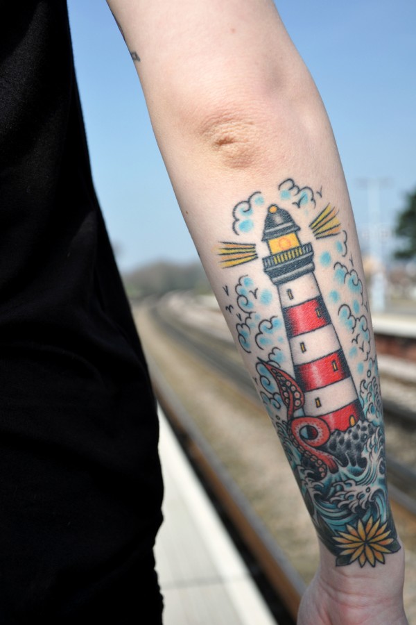 Lovely lighthouse arm tattoo