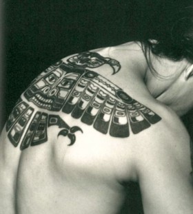 Lovely looking tribal bird tattoo