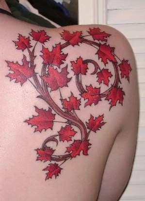 Lovely maple leaves back tattoo