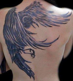 Lovely raven back tattoo