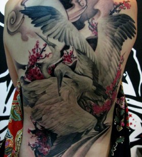 Magical crane back tattoo