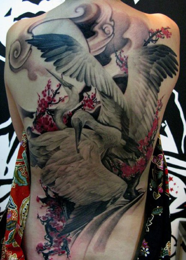 Magical crane back tattoo