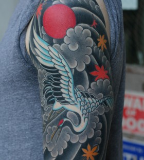 Magnificent crane arm tattoo