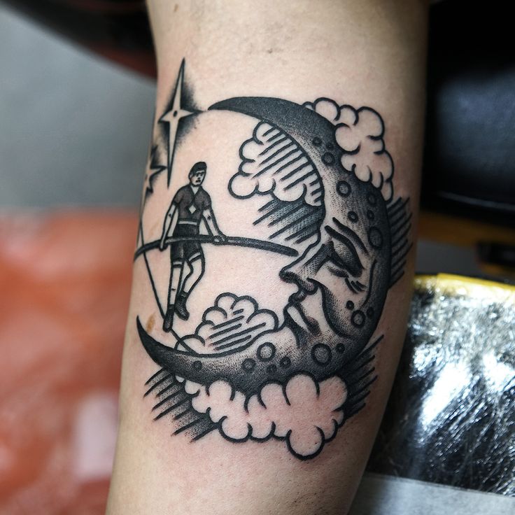 Man and moon tattoo by Philip Yarnell