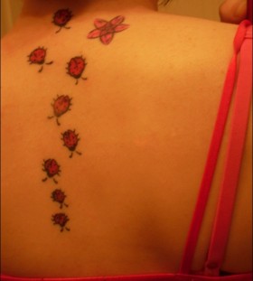 Many ladybugs back tattoo