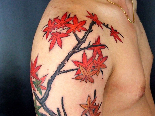 Maple leaves arm tattoo