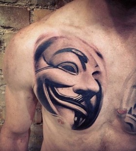 Mask of V chest tattoo
