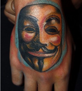 Mask of V hand tattoo