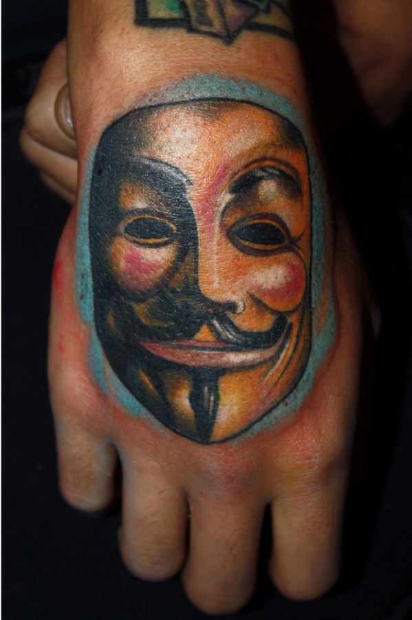 Mask of V hand tattoo