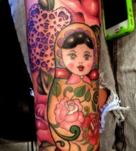 Matryoshka and flowers tattoo