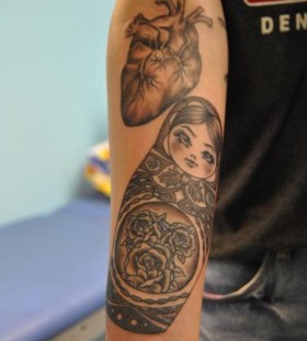 Matryoshka and heart tattoo