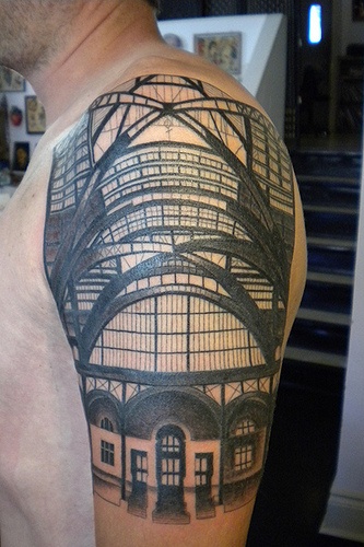 Men’s shoulder’s architecture tattoo