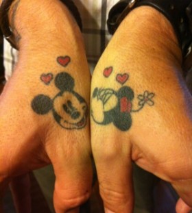 Minnie and Mickey thumb tattoos