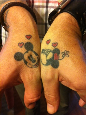 Minnie and Mickey thumb tattoos