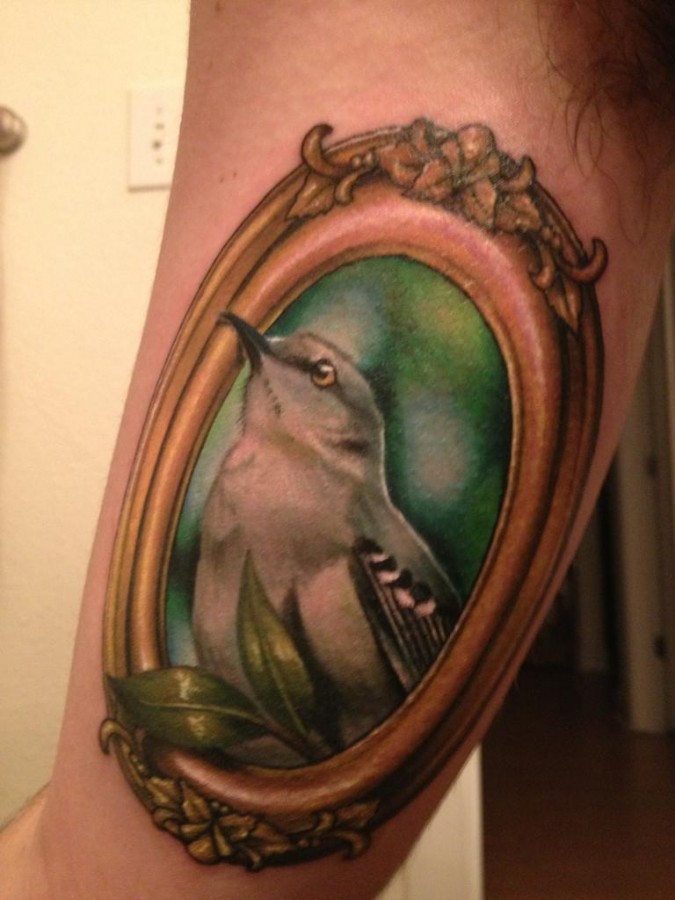 Mockingbird frame arm tattoo