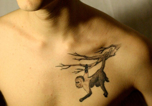 Monkey on a branch tattoo