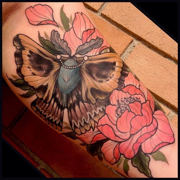 Moth and flowers tattoo