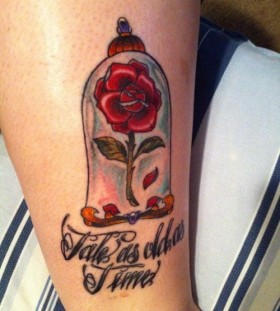 Nice enchanted rose and quote tattoo