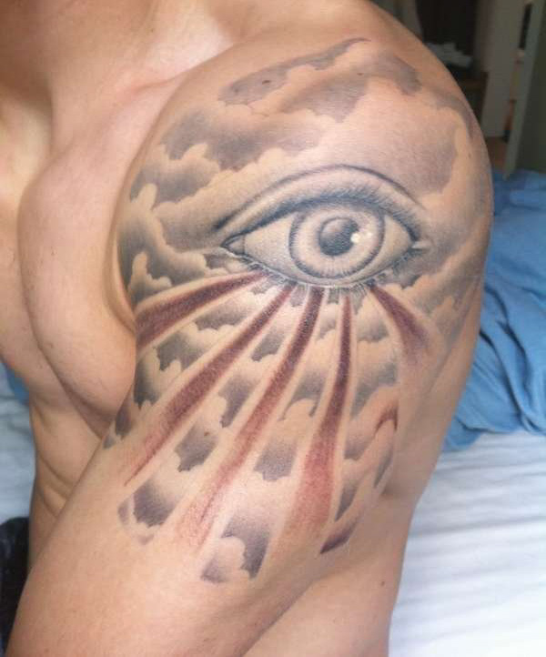 Nice eye and clouds tattoo