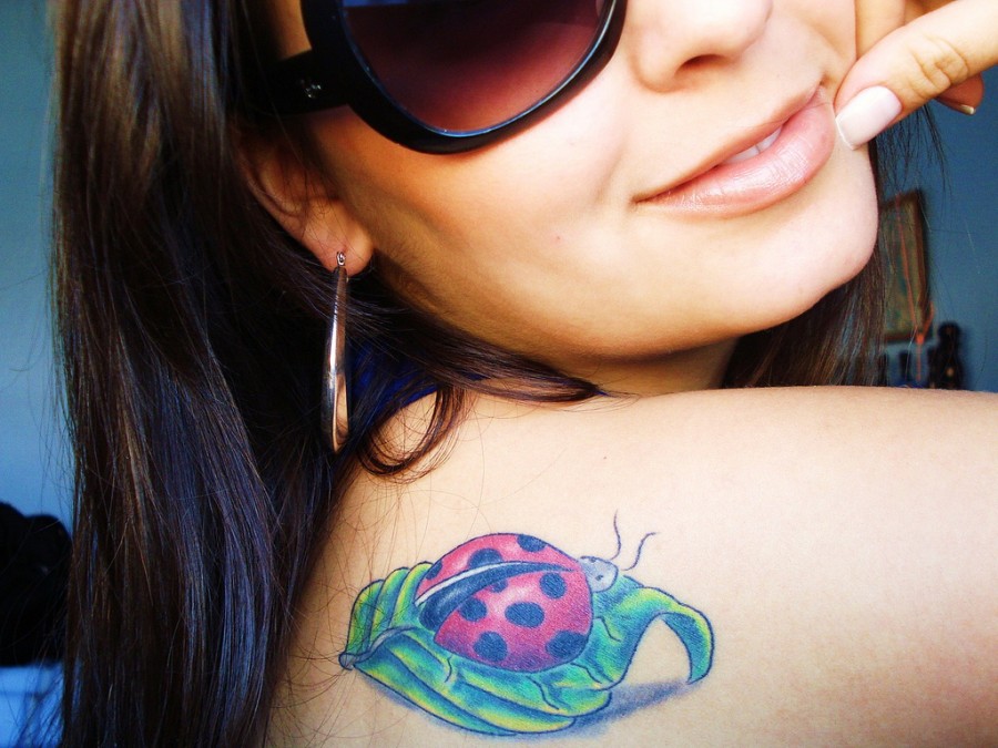 Nice ladybug and leaf tattoo