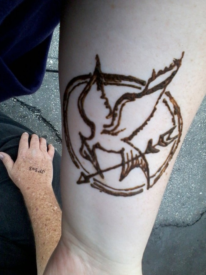 Nice mockingjay arm tattoo