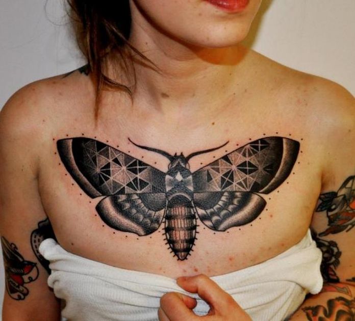 Nice moth chest tattoo