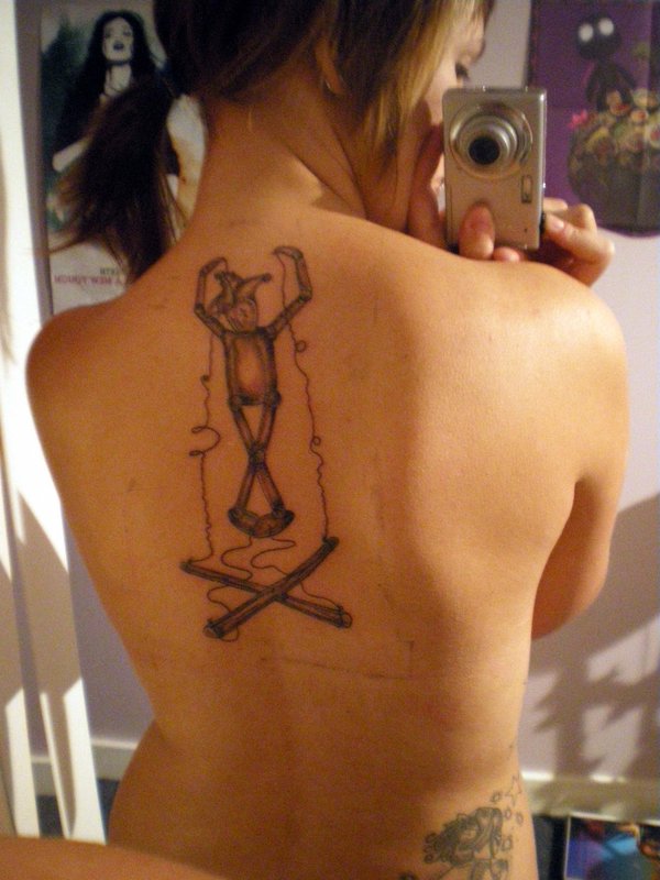 Nice puppet back tattoo