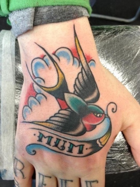 Nice swallow hand tattoo