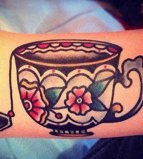 Nice teacup arm tattoo